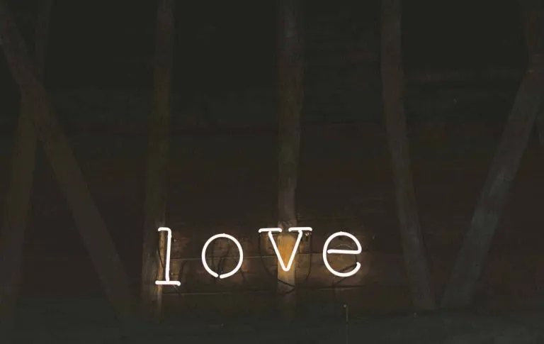 A neon sign that says "love"