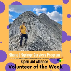 A picture of a volunteer on a mountainside for our volunteer of the week post
